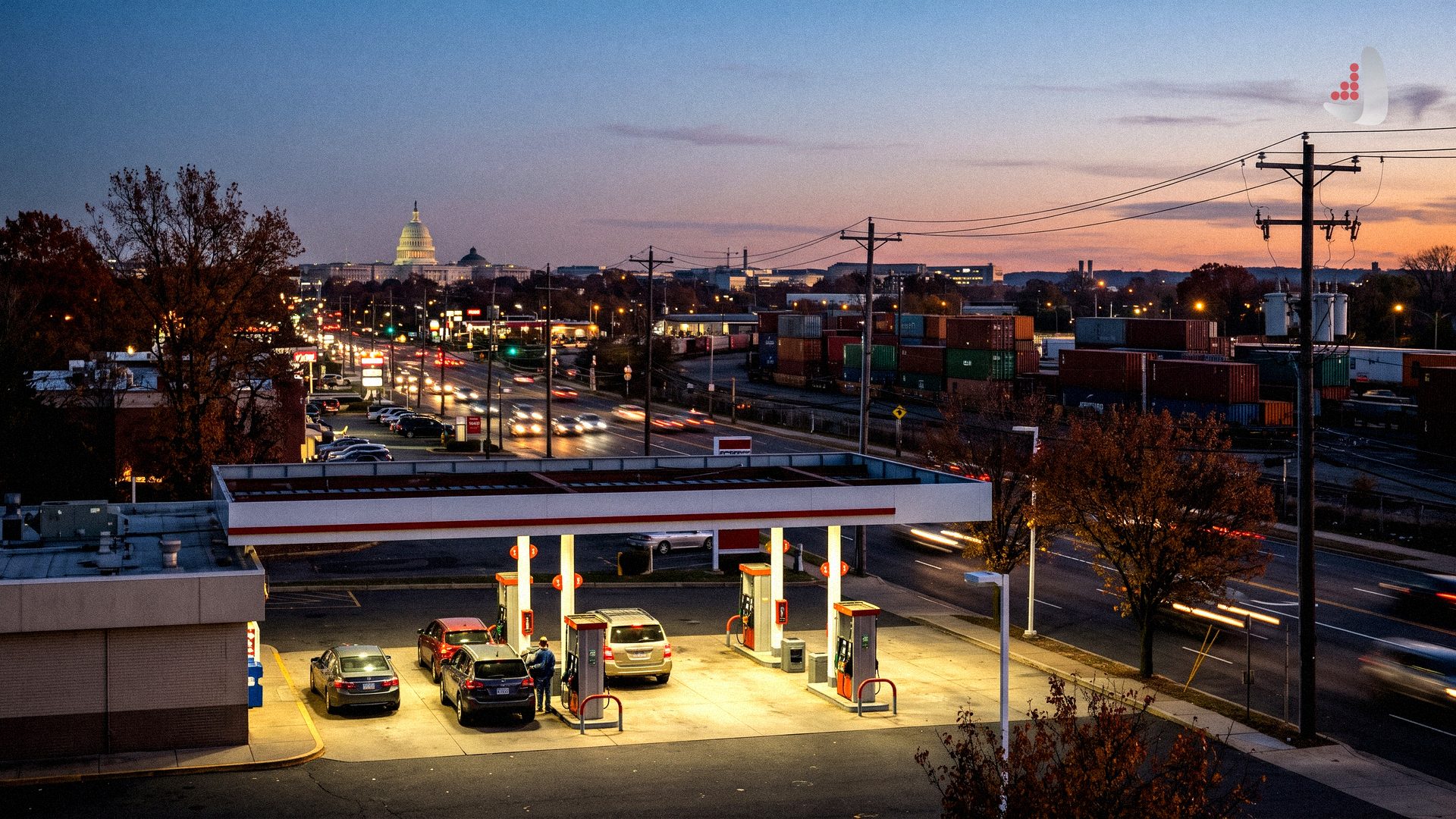 Gas station at dusk with the US Capitol building in the distance