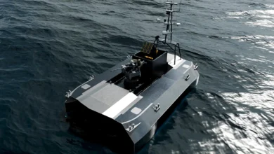 Graphic illustration of an armed military uncrewed surface vessel navigating ocean waves