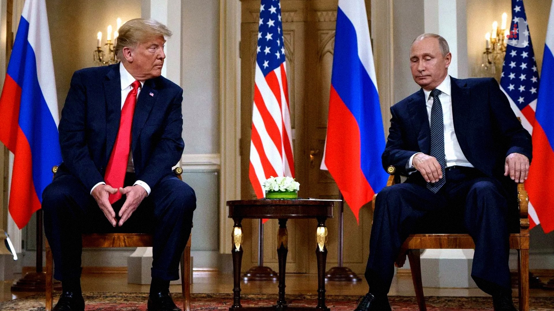 Donald Trump and Vladimir Putin are depicted alongside hands shaking and sections of a map of Ukraine
