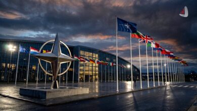 NATO star sculpture and member state flags outside the NATO headquarters in Brussels